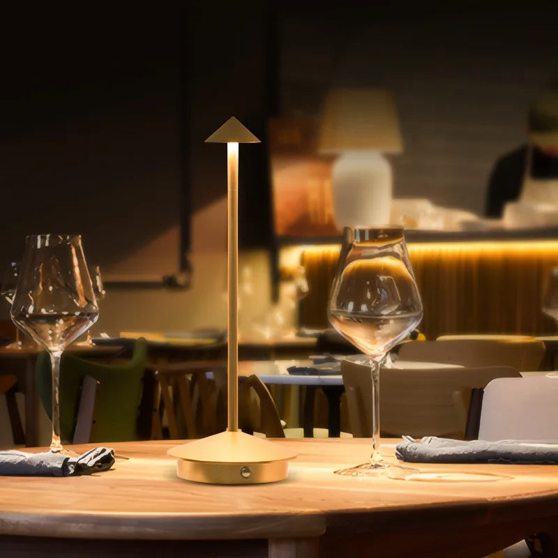 Rechargeable LED table lamp with touch control, white color, on a desk
