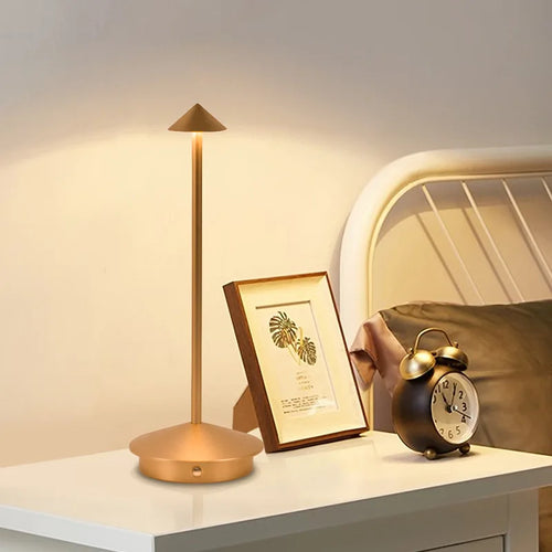 Rechargeable LED table lamp with touch control, white color, on a desk