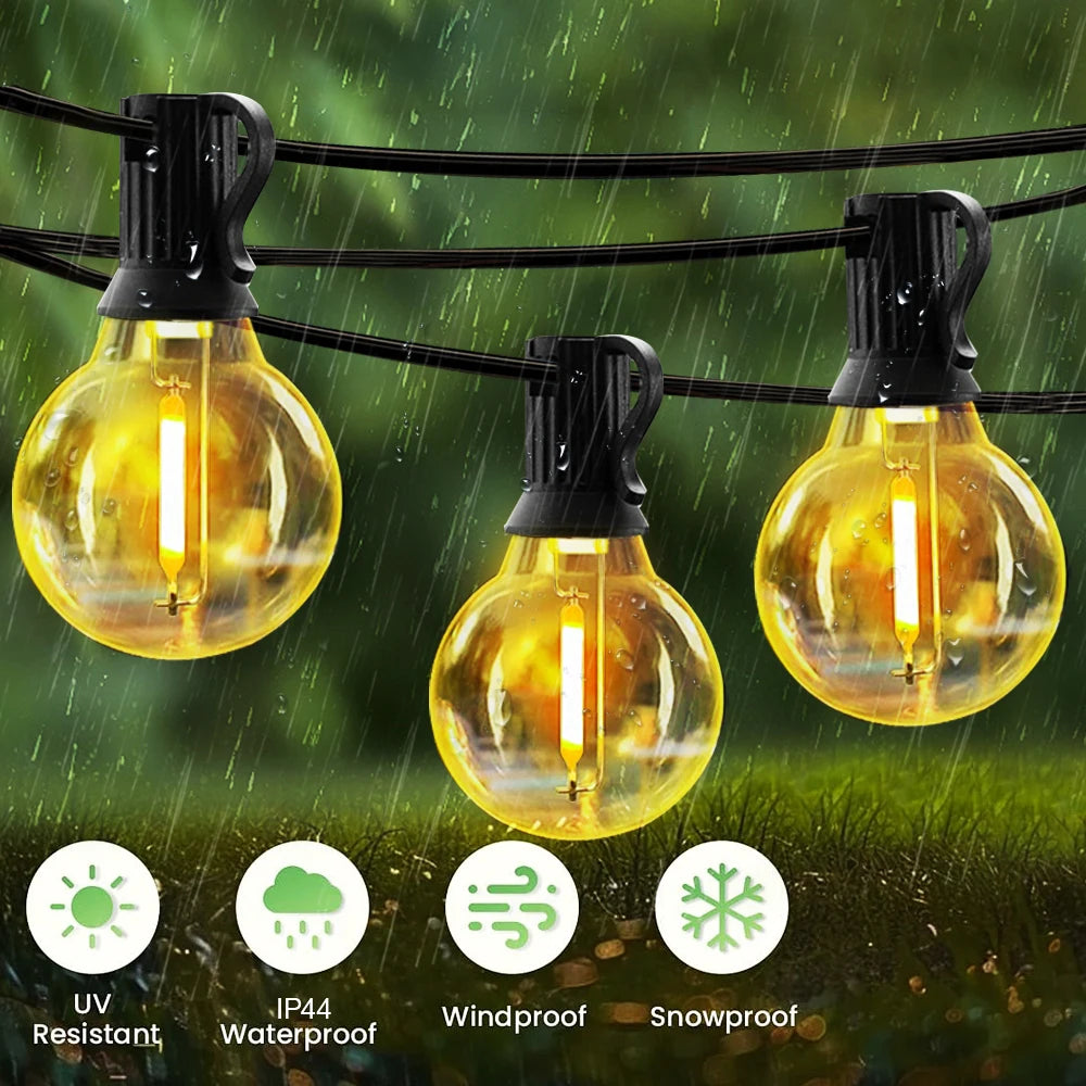 Set of solar-powered G40 globe string lights illuminating a garden patio area at dusk