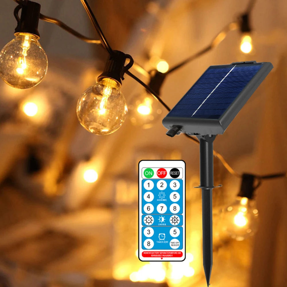 Set of solar-powered G40 globe string lights illuminating a garden patio area at dusk